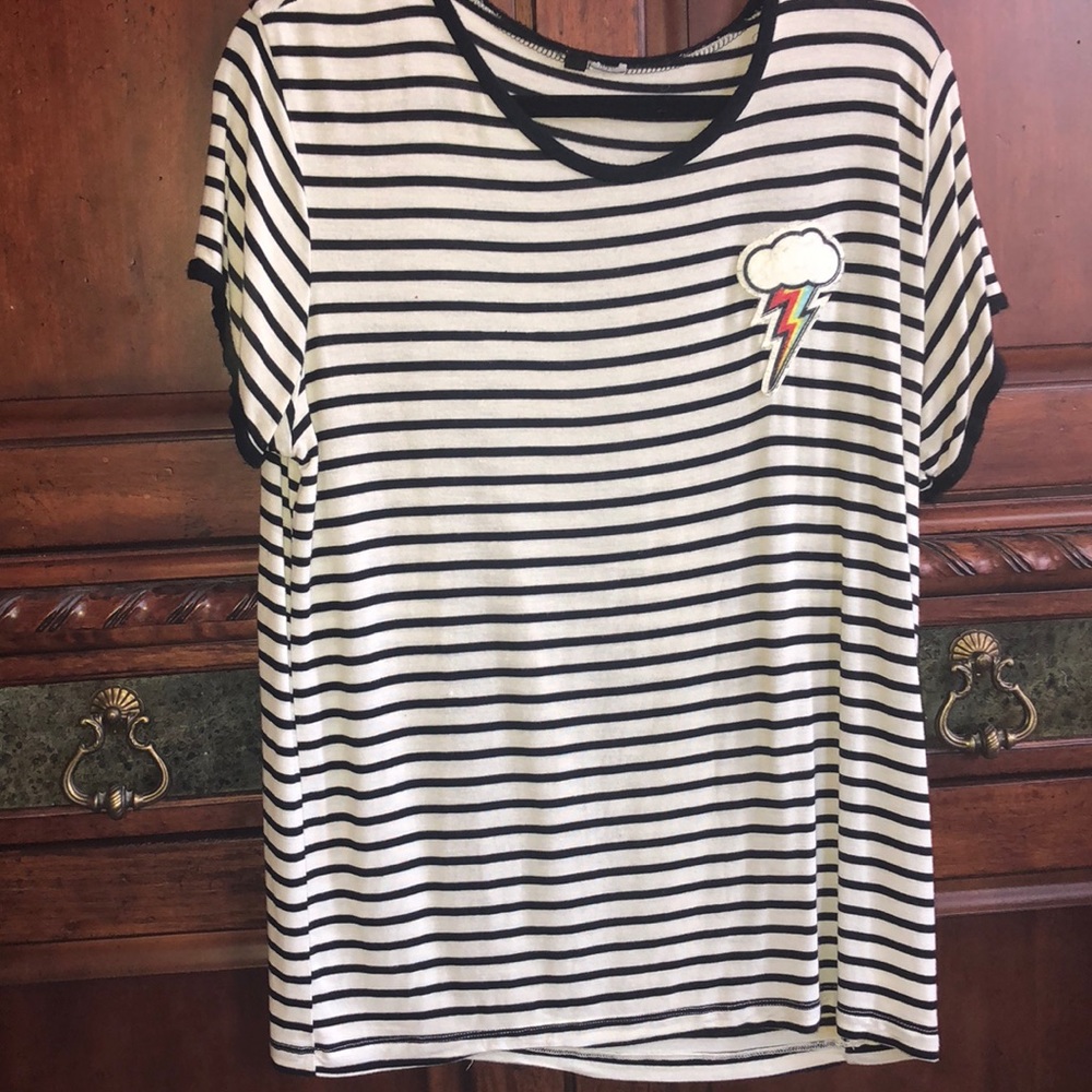Long striped shirt with a lightning bolt patch